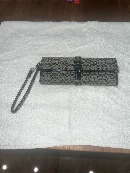 Coach Handbags - Coach Black/Tan Signature Canvas Wristlet Clutch.